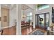 Grand foyer with soaring ceilings, hardwood floors, and elegant dining area at 6942 Indian Creek Park Dr, Lakeland, FL 33813