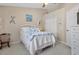 Nautical themed bedroom features a cozy bed, closet and neutral decor at 720 Lake Jessie Dr, Winter Haven, FL 33881