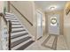 Entryway boasts tile flooring and a stairway at 720 Lake Jessie Dr, Winter Haven, FL 33881