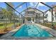 Inviting screened pool with brick paver deck and backyard views at 720 Lake Jessie Dr, Winter Haven, FL 33881