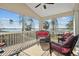 Relaxing screened porch featuring views of the water and comfortable seating at 720 Lake Jessie Dr, Winter Haven, FL 33881