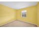 Bedroom featuring a window and carpeting at 736 Hunt Dr, Lake Wales, FL 33853