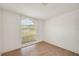 Bedroom showcasing natural light and laminate flooring at 736 Hunt Dr, Lake Wales, FL 33853