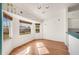 Bright dining area featuring hardwood floors, natural light, and bee themed decals at 736 Hunt Dr, Lake Wales, FL 33853