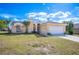 Single-story home with a spacious two-car garage and manicured lawn at 736 Hunt Dr, Lake Wales, FL 33853