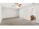 Spacious main bedroom showcasing plush carpeting, neutral paint, and an en-suite bathroom at 7444 Hunters Greene Cir, Lakeland, FL 33810