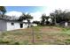 Large fenced-in backyard with ample space for outdoor activities and gardening at 745 4Th St, Polk City, FL 33868