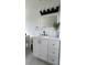 Bathroom featuring white vanity with modern lighting and fixtures at 745 4Th St, Polk City, FL 33868