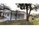 Spacious carport providing covered parking and outdoor space at 745 4Th St, Polk City, FL 33868