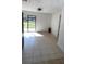 A bright dining area with tile flooring and sliding glass doors leading to the outside at 745 4Th St, Polk City, FL 33868