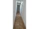 Hallway with tile flooring and white walls at 745 4Th St, Polk City, FL 33868