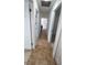 Hallway with tiled flooring and white doors at 745 4Th St, Polk City, FL 33868