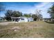 Home featuring a spacious backyard, with an outdoor storage shed at 808 Spirit Lake Rd, Winter Haven, FL 33880