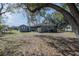 Home's spacious backyard featuring a shed and plenty of room at 808 Spirit Lake Rd, Winter Haven, FL 33880