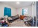 Bedroom with a single bed, a gray papasan chair, and a wood dresser at 808 Spirit Lake Rd, Winter Haven, FL 33880