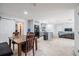 Bright dining area with open concept to kitchen and living, sliding door and neutral walls at 808 Spirit Lake Rd, Winter Haven, FL 33880