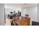 Open floor plan featuring a dining area with a wood table adjacent to the kitchen and living room at 808 Spirit Lake Rd, Winter Haven, FL 33880