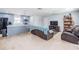 Open living room with a view of the island kitchen, light walls and neutral flooring at 808 Spirit Lake Rd, Winter Haven, FL 33880