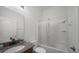 Bright bathroom with granite counters, white cabinetry and shower/tub combination at 824 Ulmer Rd, Frostproof, FL 33843