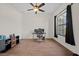 Neutral bedroom with a ceiling fan, great natural light, and hardwood floors at 824 Ulmer Rd, Frostproof, FL 33843