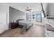 Bright bedroom featuring wood floors, neutral grey decor and ceiling fan at 824 Ulmer Rd, Frostproof, FL 33843