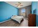 Bedroom featuring a ceiling fan, window and nice color palette at 824 Ulmer Rd, Frostproof, FL 33843