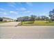 Front exterior of a single-Gathering home with a two car garage and front yard at 824 Ulmer Rd, Frostproof, FL 33843