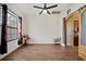 Cozy living room with hardwood floors and archway to other rooms at 824 Ulmer Rd, Frostproof, FL 33843