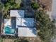 Overhead view of a home with an in-ground pool, well-maintained landscaping, and a fenced-in backyard at 827 Sherwood Dr, Lake Wales, FL 33898