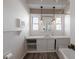 Bathroom featuring built-in storage and a unique sink area with decorative lighting fixtures at 827 Sherwood Dr, Lake Wales, FL 33898