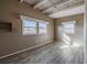 Bedroom with wood style flooring, neutral paint and two windows bringing in natural light at 827 Sherwood Dr, Lake Wales, FL 33898