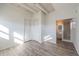 Bedroom features hardwood-style flooring with an attached bathroom at 827 Sherwood Dr, Lake Wales, FL 33898