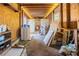 Unfinished garage with concrete walls, wood paneling and exposed ceiling at 827 Sherwood Dr, Lake Wales, FL 33898