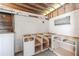 Unfinished kitchen with concrete walls, open cabinetry, and concrete floors at 827 Sherwood Dr, Lake Wales, FL 33898