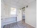 Laundry room with shelving, a utility sink, and an exterior door for easy access at 827 Sherwood Dr, Lake Wales, FL 33898