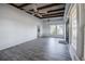 Open living room with hardwood-style flooring and exposed beam ceiling at 827 Sherwood Dr, Lake Wales, FL 33898