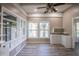 Bright living room featuring gray flooring, natural light from windows, and stylish built-in shelving at 827 Sherwood Dr, Lake Wales, FL 33898