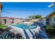 Sparkling in-ground pool featuring a surrounding deck and a screened enclosure, perfect for outdoor enjoyment at 827 Sherwood Dr, Lake Wales, FL 33898