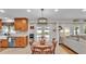 Bright dining area with hardwood table set and backyard view through french doors to the swimming pool at 860 Lila St, Bartow, FL 33830