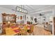 Dining room with wood floors, a decorative chandelier, and connection to kitchen and living spaces at 860 Lila St, Bartow, FL 33830