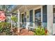 Quaint front porch with cozy seating and charming decor, a perfect spot to relax and enjoy the outdoors at 860 Lila St, Bartow, FL 33830