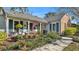 Inviting porch adorned with plants and outdoor seating creating a welcoming entrance to the home at 860 Lila St, Bartow, FL 33830