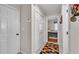 Hallway with closet and entrance to bedroom with a patterned rug at 860 Lila St, Bartow, FL 33830