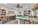 Spacious hobby room with large worktable, ample storage shelves, and natural light for crafts and projects at 860 Lila St, Bartow, FL 33830