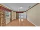 Light-filled bedroom featuring hardwood floors and direct access to the pool area at 1047 Sugartree S Ln, Lakeland, FL 33813