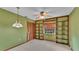 Bedroom with built in shelving and ceiling fan at 1047 Sugartree S Ln, Lakeland, FL 33813