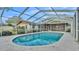 Screened-in pool with attached lanai offers plenty of room for outdoor fun at 1047 Sugartree S Ln, Lakeland, FL 33813