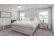 Bright bedroom features large bed, natural light, and modern decor at 1108 Mountain Flower Ln, Davenport, FL 33837