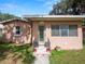 Close up on the home's entrance, with the house number and a neatly landscaped entryway at 116 S Lanier Ave, Fort Meade, FL 33841