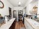 Well-lit kitchen featuring white cabinetry, granite countertops, and stainless steel appliances at 116 S Lanier Ave, Fort Meade, FL 33841